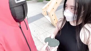 Asian girl participates in a twisted version of Squid Game