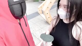 Asian girl participates in a twisted version of Squid Game