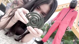 Asian girl participates in a twisted version of Squid Game