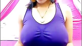 Her nipples are standing out, her t-shirt is wet and transparent