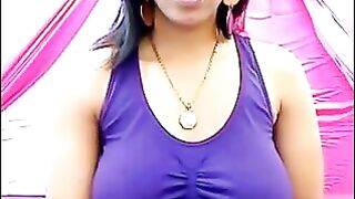 Her nipples are standing out, her t-shirt is wet and transparent