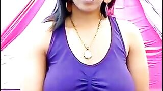 Her nipples are standing out, her t-shirt is wet and transparent