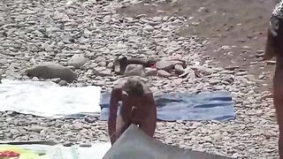 A little naked fun on the beach with a couple