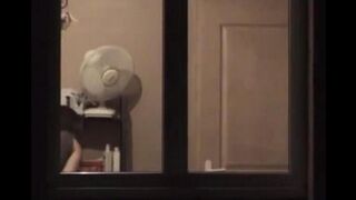 The guy admires himself in the mirror, not leaving anything to chance