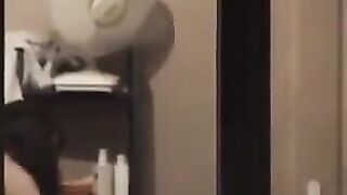 The guy admires himself in the mirror, not leaving anything to chance