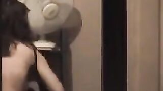 The guy admires himself in the mirror, not leaving anything to chance