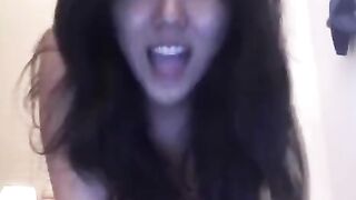 Asian beauty masturbates on the bed, showcasing her solo session