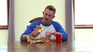 A wife fucked herself in the kitchen with a cucumber