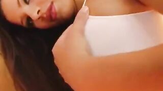 The girl plays with her big pussy with dildo