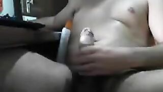 Guy sat in front of the computer and masturbating his dick