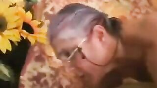 An old gray-haired woman in black stockings gets fucked hard