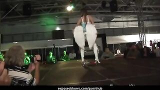 A cute hot brunette learns to work with a striptease pole for the first time