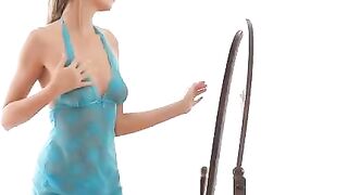 A sexy girl is making erotic moves in front of the mirror