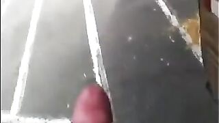 The guy masturbates his big cock right on the street