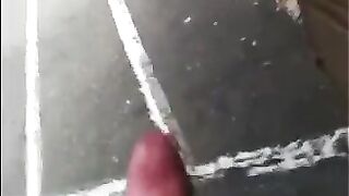 The guy masturbates his big cock right on the street