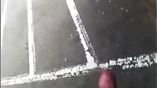 The guy masturbates his big cock right on the street