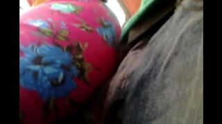 A man rubs his dick through a riser on the bus with some girls
