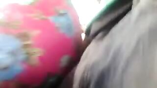 A man rubs his dick through a riser on the bus with some girls