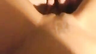 A sexy and thin girl has sex on the bed with a close-up camera