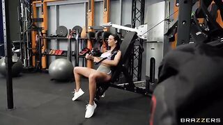 The girl is having fun with her girlfriend in the gym, making holes