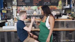 The girl with big tits is working as a barista in the coffee shop