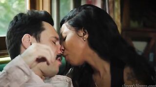 A girl is having sex with a guy who looks like a hitman