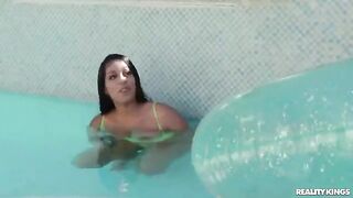 A cute girl teaching how to swim in the pool