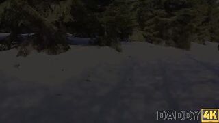 A hot chick is having fun on a sled near the fireplace