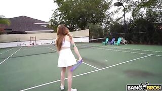 The girl is having fun with her tennis coach on the court
