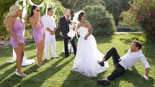 The bride is having fun with the best man and other guys