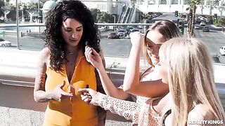 A hot chick is having fun with girls on the strip
