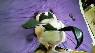A fine lady in a bunny suit has long socks and stockings on