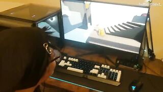 A cute couple has fun playing a video game and then they kiss