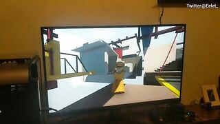 A cute couple has fun playing a video game and then they kiss