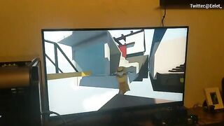 A cute couple has fun playing a video game and then they kiss