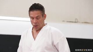 The cute girl is getting fucked in an uncomfortable pose by a trainer