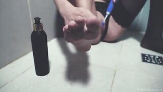 In the shower, a naked girl plays with sex toys and reaches orgasm