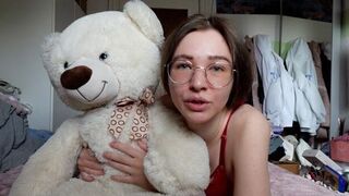 A cute girl has fun with her best friend, a teddy bear
