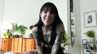 A hot girl with tattoos is using a vibrator in the most seductive way ever