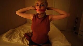 A sexy girl in black stockings plays with a dildo, embodying Resident Evil’s intense vibe