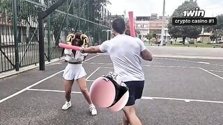 A sexy girl is having fun with her personal trainer in the gym