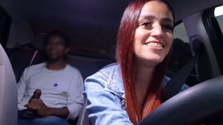 A hot chick is getting fucked in the car on the public road