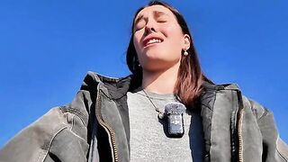 The girl achieves spiritual harmony through solo play outdoors