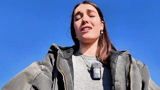 The girl achieves spiritual harmony through solo play outdoors